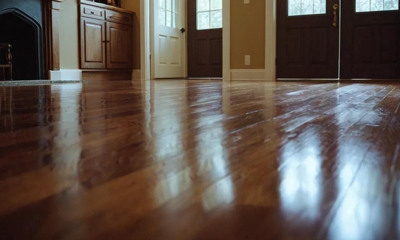 A close-up photo of a hardwood floor partially covered in bleach, showcasing the potential damage caused by using bleach on such surfaces.