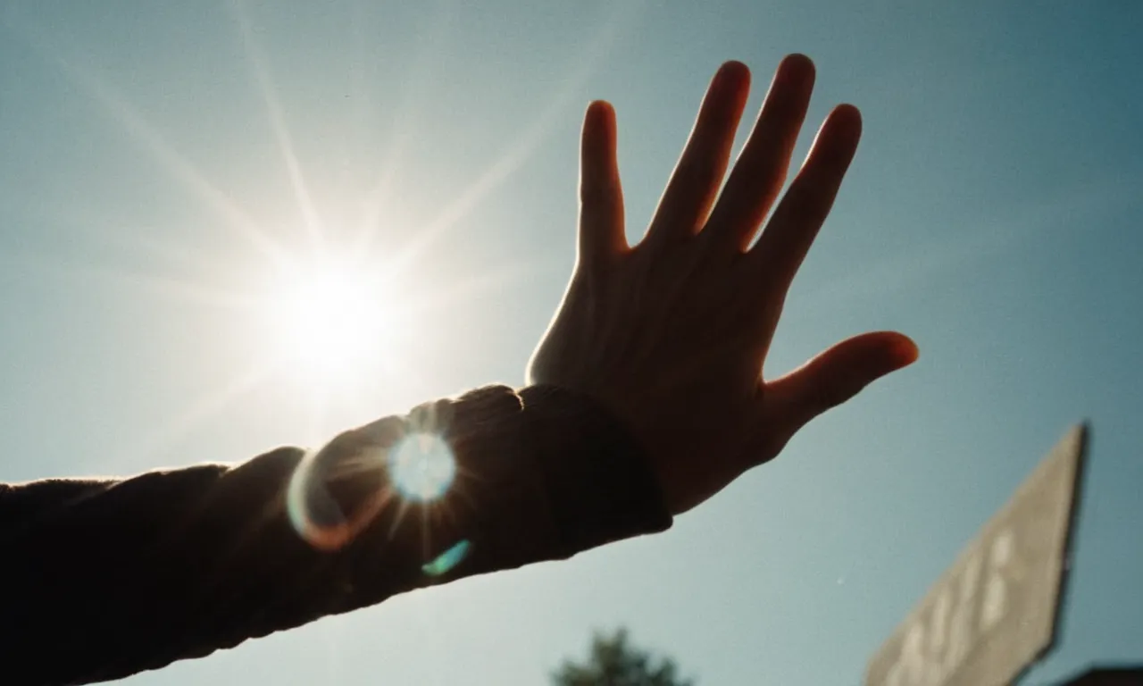 A captivating photo capturing the resilient spirit of a person, their hand reaching out towards the light, as they rise determinedly from the floor, symbolizing strength, resilience, and the power of overcoming adversity.