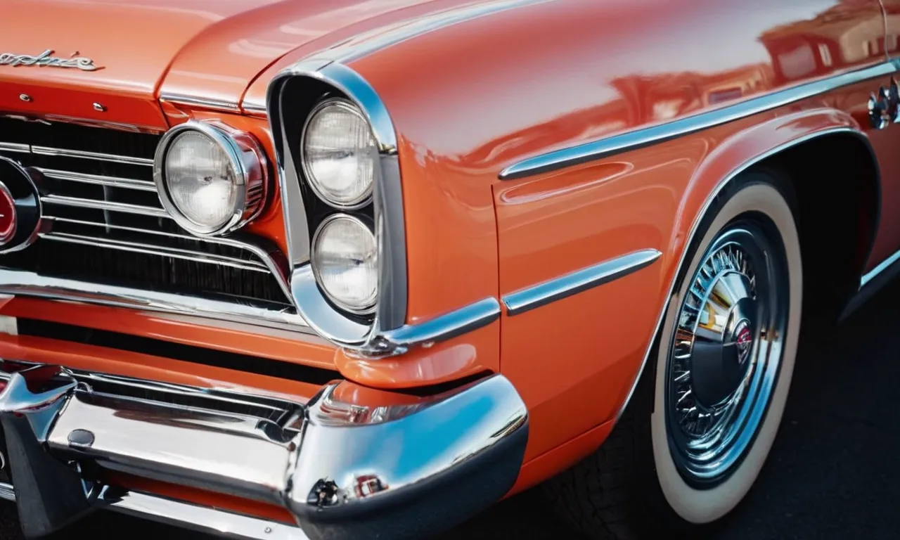 A close-up shot of a vintage car's glossy paint, showcasing its vibrant color and flawless finish, leaving viewers curious about the longevity and durability of such a stunning automotive masterpiece.