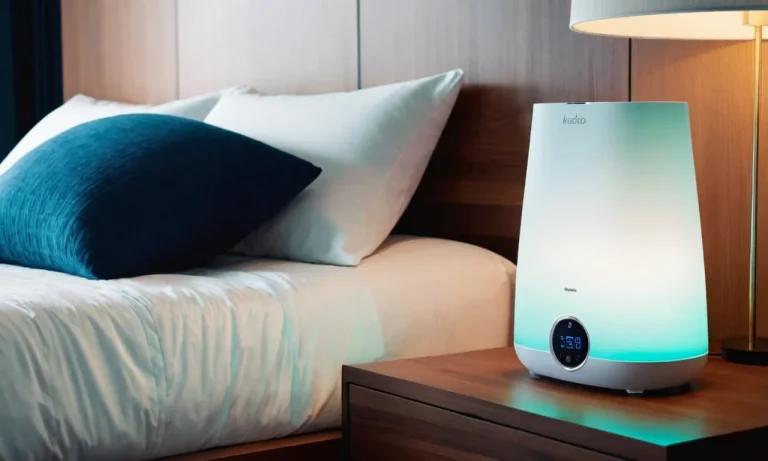 A close-up shot of a sleek, modern cool mist humidifier placed on a nightstand, surrounded by soft, ambient lighting, creating a serene and comfortable atmosphere in a bedroom.