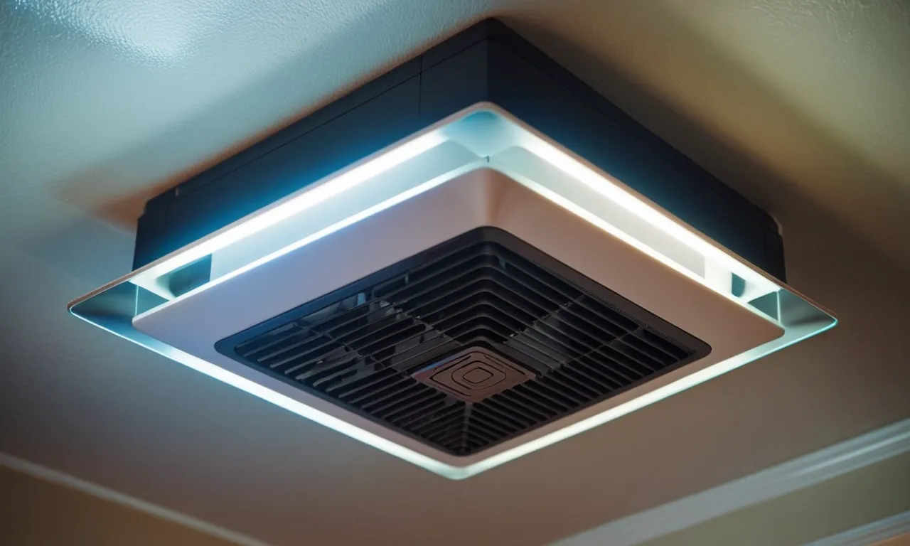 A close-up photo showcasing a sleek bathroom exhaust fan with a built-in light and heater, providing both functionality and modern aesthetics.