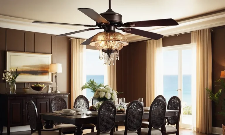 A well-lit dining room showcasing a sophisticated chandelier-style ceiling fan, exuding elegance and functionality with its sleek design and gentle breeze, perfect for enhancing dining experiences.
