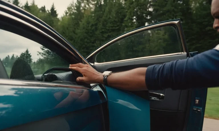 A close-up photo showcasing a car door suspended in mid-air, emphasizing its weight through the strained muscles of a person struggling to hold it, capturing the essence of its heaviness.