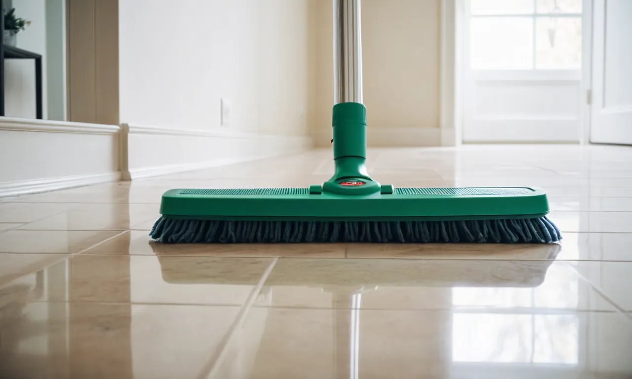 A close-up photo showcasing a mop with a long handle and a wide, flat head, standing against a clean, white wall with a reflection of a spotless ceiling, emphasizing its effectiveness in cleaning hard-to-reach areas.