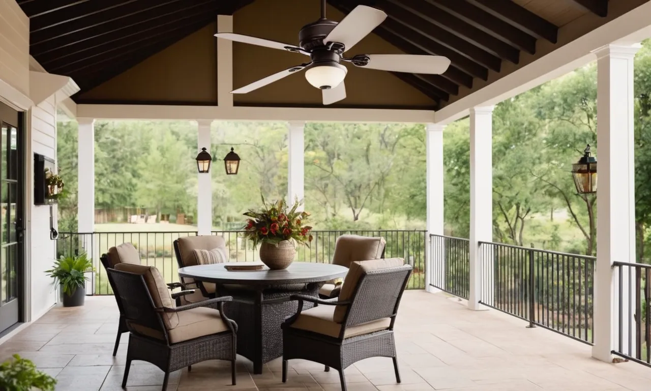 A stunning image capturing a stylish outdoor patio with a beautiful ceiling fan adorned with a light fixture, creating a perfect ambiance for relaxation and comfort.