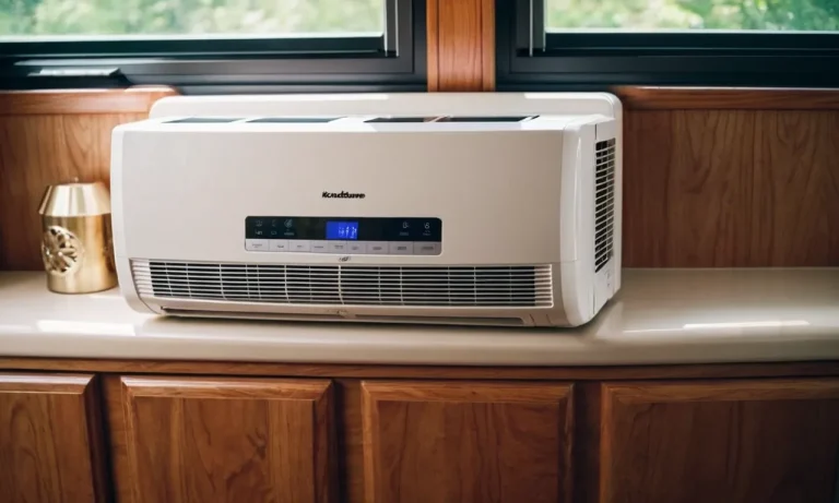 A close-up shot of a sleek, compact air conditioner unit installed in the window of an RV, providing cool relief on a hot summer day, making it the best portable air conditioner for RVs.