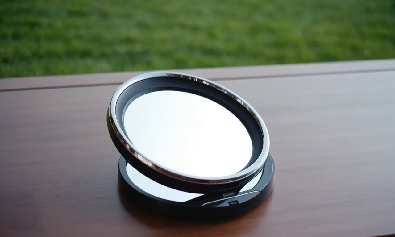A close-up shot of a sleek, modern makeup mirror illuminated by soft, diffused light, showcasing its 10x magnification capabilities and enhancing the reflection of flawless, perfectly applied makeup.