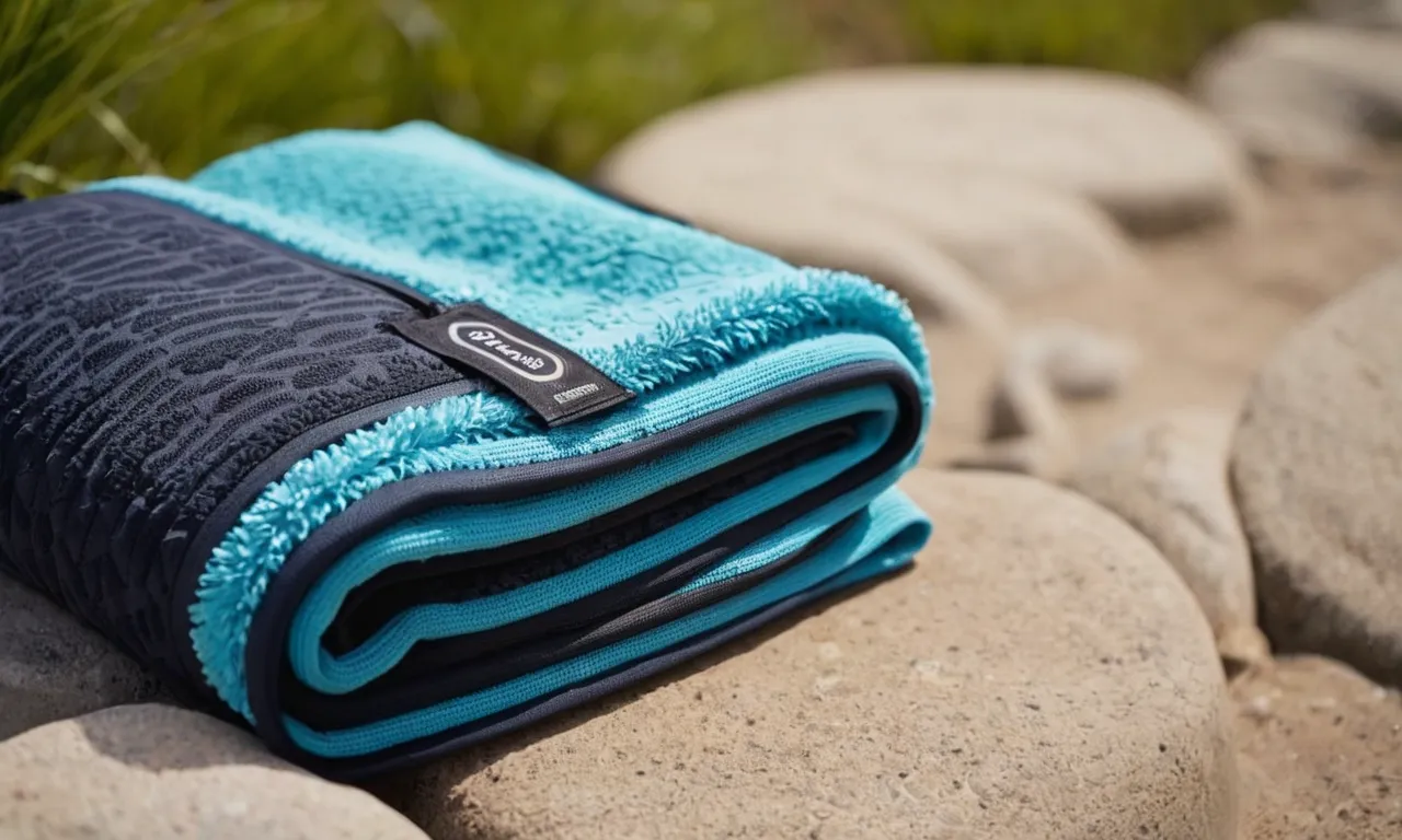 A close-up shot of a compact, lightweight quick dry towel neatly folded and placed next to a backpack, ready to be packed for a travel adventure.