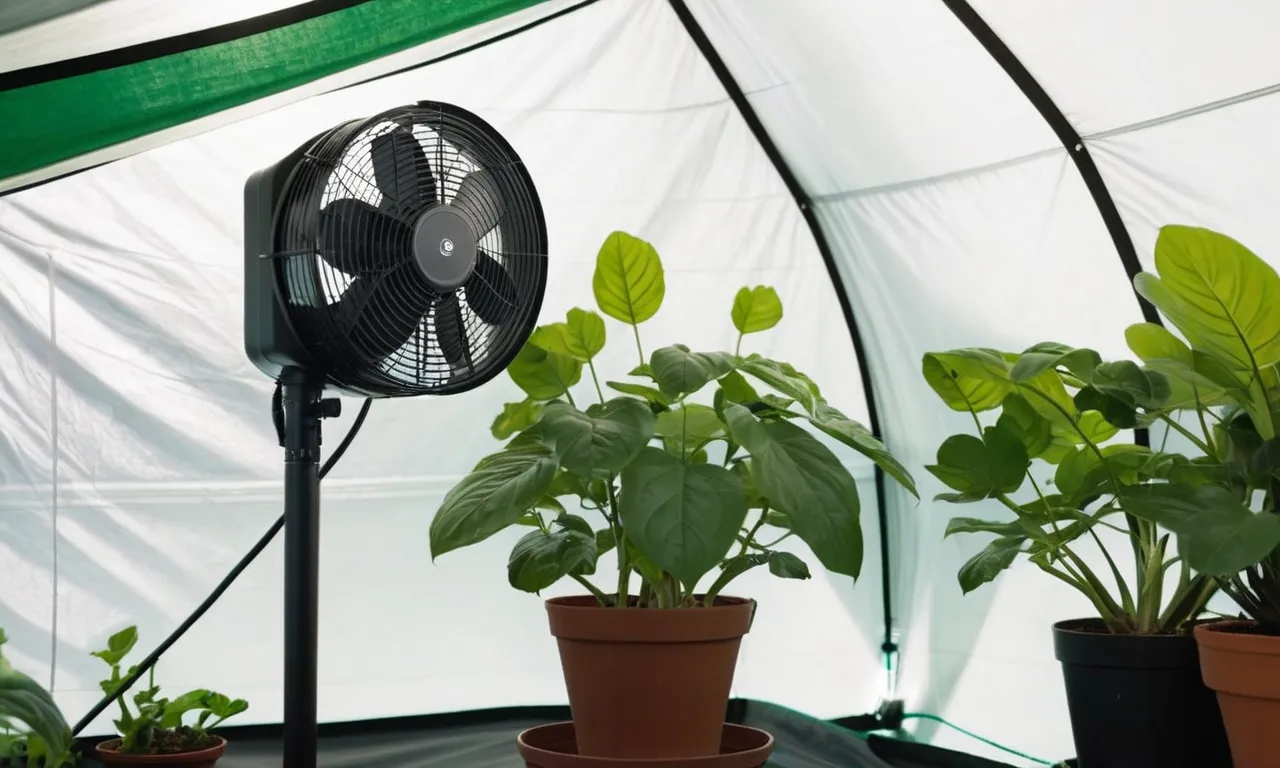 A close-up photo capturing a small clip-on fan attached securely to a grow tent pole, providing optimal air circulation and promoting healthy plant growth.