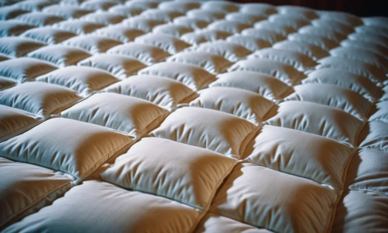 A close-up shot capturing the luxurious texture of a king-sized heated mattress pad, with dual control settings, exuding warmth and comfort.