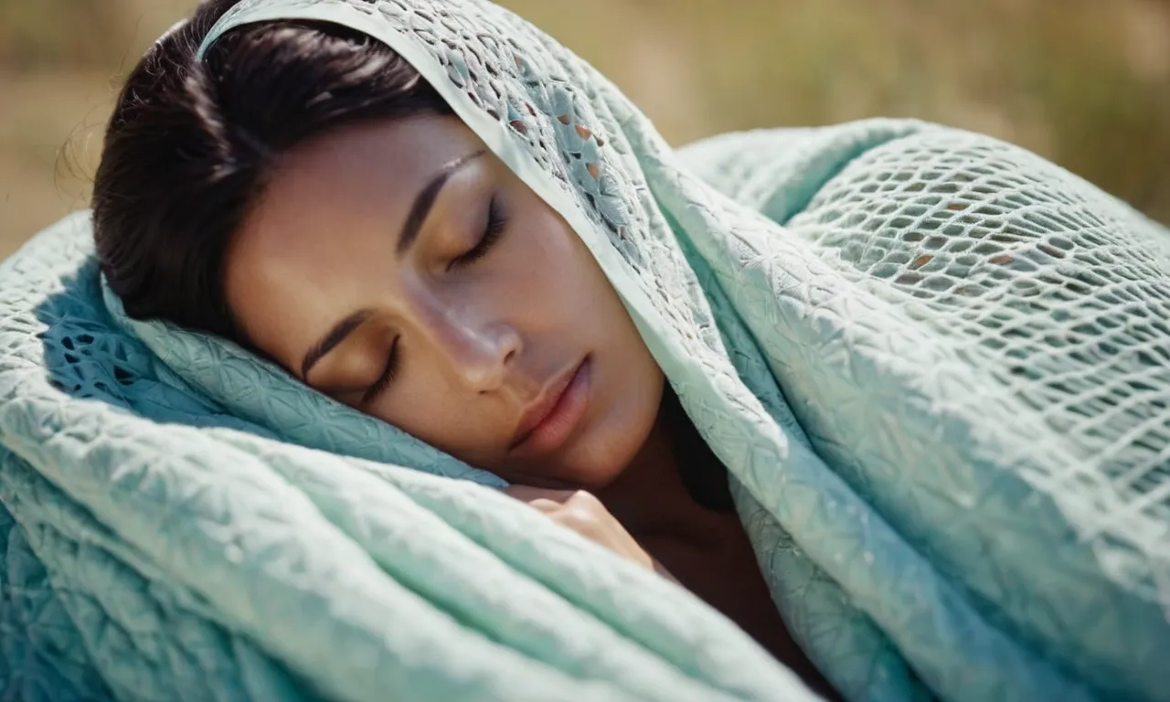 A close-up shot of a serene, sleeping figure blissfully cocooned in a lightweight, breathable cooling blanket, surrounded by a gentle breeze symbolizing optimal temperature regulation for hot sleepers.