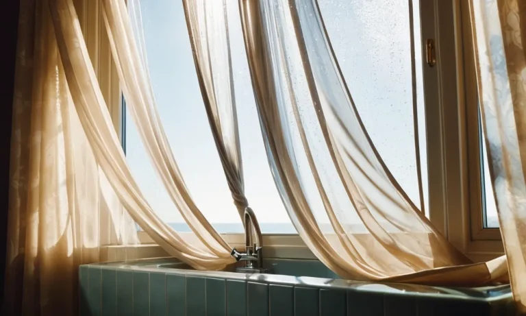 The photo captures a pair of delicate sheer curtains gently swaying in a breeze, immersed in a basin of soapy water, as sunlight filters through, highlighting their translucent beauty.