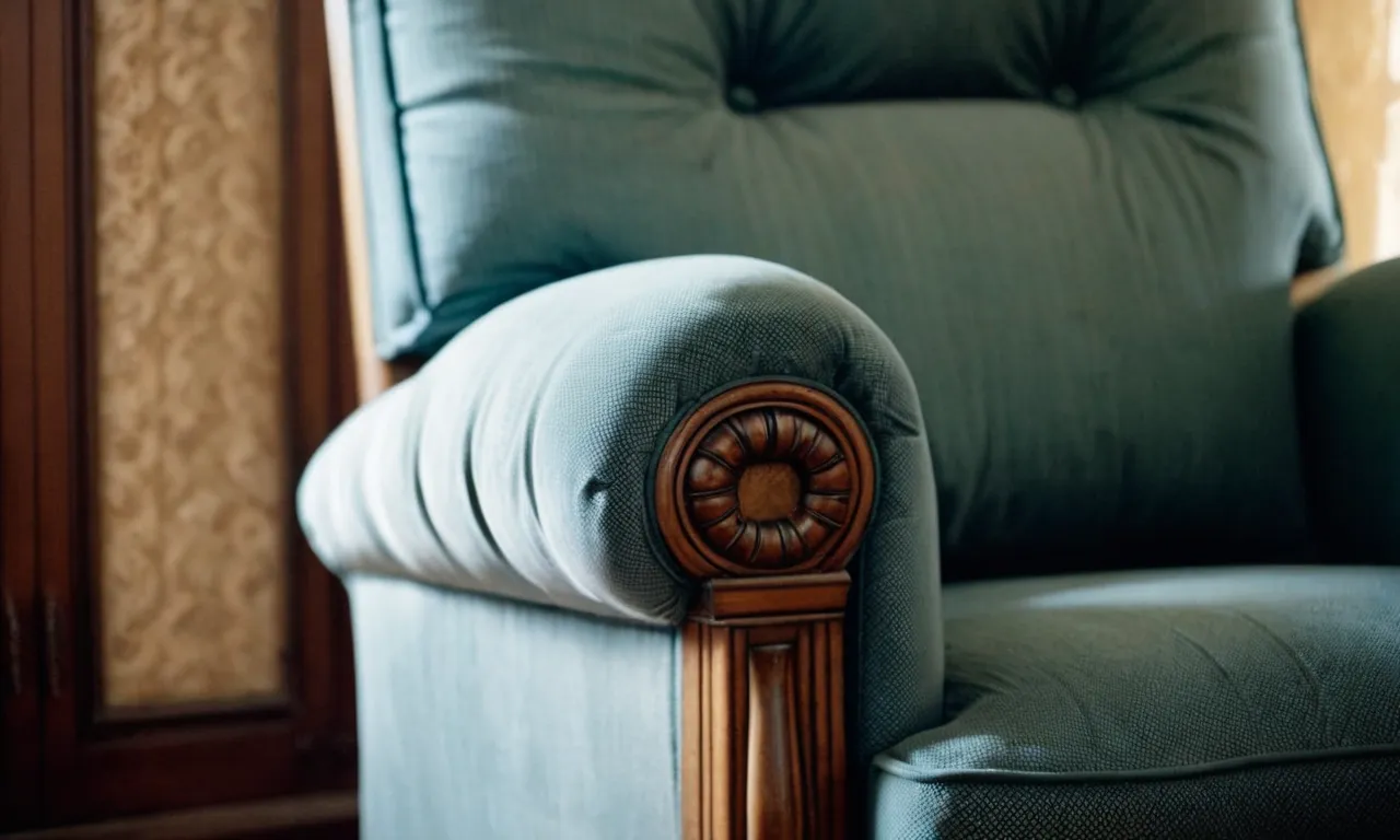 A close-up photo captures the intricate details of a vintage armchair, revealing the subtle presence of slave hair within its stuffing, serving as a haunting reminder of a dark chapter in history.