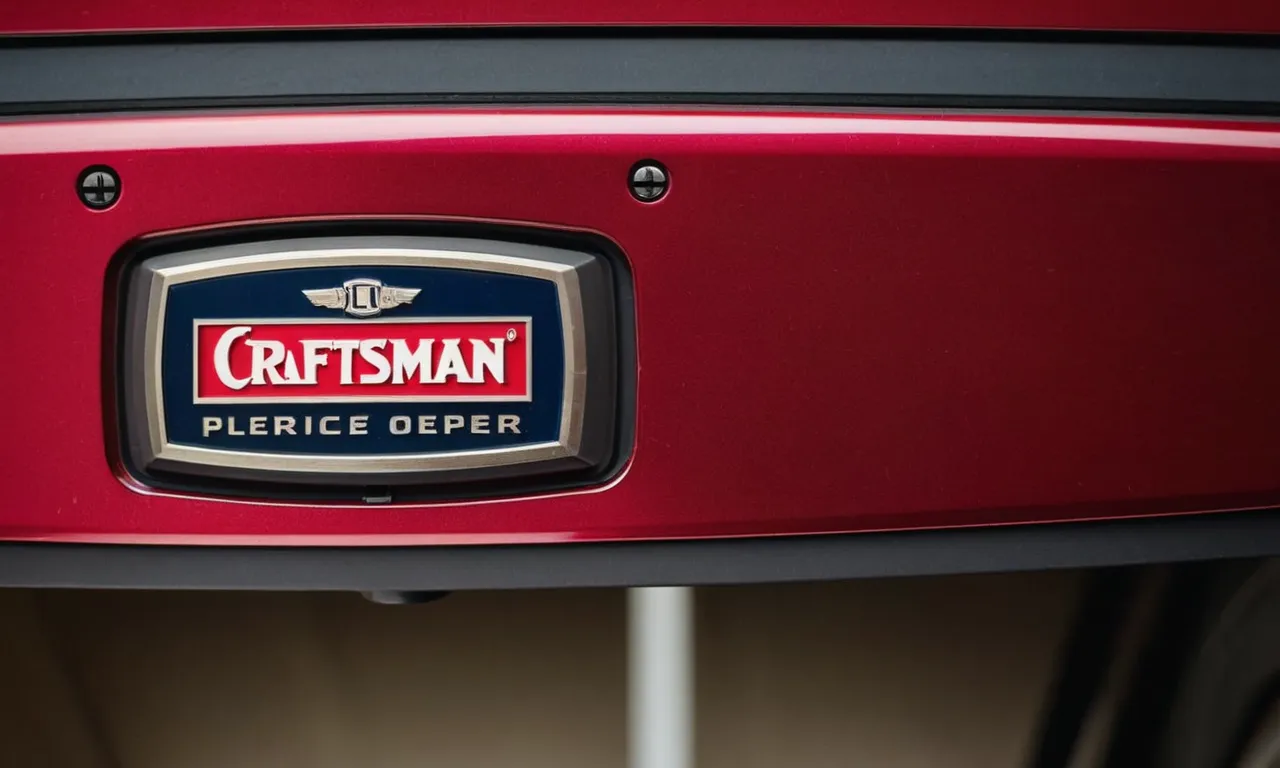 A close-up photo of a Craftsman logo etched onto a sleek garage door opener, showcasing the brand's craftsmanship and attention to detail.